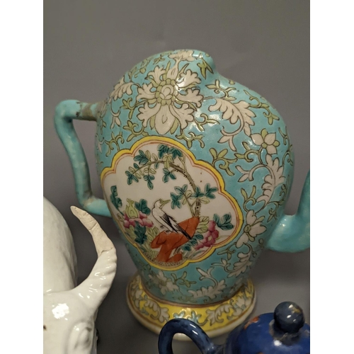 1307 - A 19th century Cadogan shape Chinese wine ewer, a Chinese blanc de chine figure riding an ox, an 18t... 