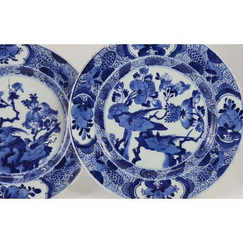 1310 - A set of three Chinese blue and white ‘pheasant’ large plates, Kangxi period,each painted with pheas... 