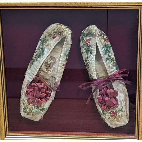 1312 - A framed pair of Regency embroidered slippers