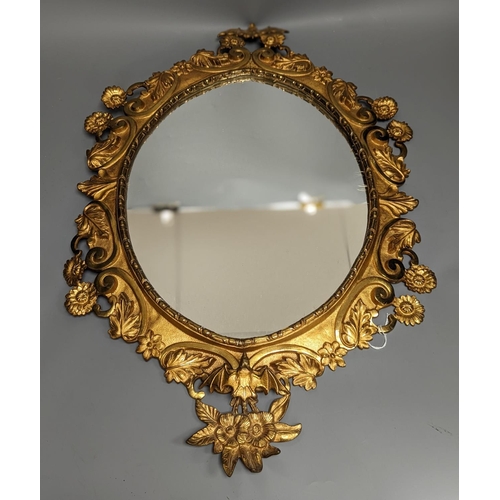 1314 - A pair of gilt brass wall mirrors, decorated with bats and flowers 56cm