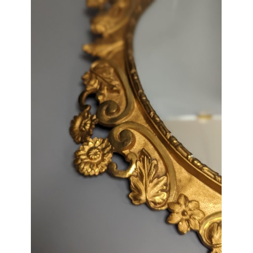 1314 - A pair of gilt brass wall mirrors, decorated with bats and flowers 56cm