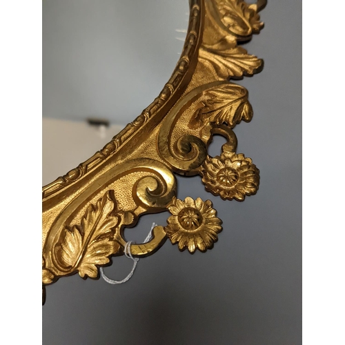 1314 - A pair of gilt brass wall mirrors, decorated with bats and flowers 56cm