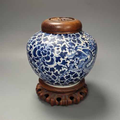 1325 - A Chinese blue and white ‘dragon’ jar, hardwood cover & stand, Qianlong mark but 19th century 22cm... 