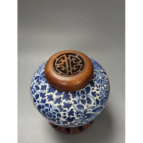 1325 - A Chinese blue and white ‘dragon’ jar, hardwood cover & stand, Qianlong mark but 19th century 22cm... 