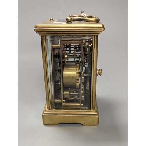 1333 - A brass cased carriage clock, with key. 16cm