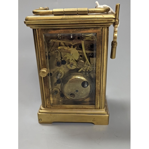 1333 - A brass cased carriage clock, with key. 16cm