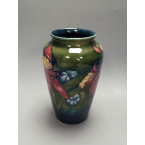 1336 - A Moorcroft orchid pattern green glazed vase, signed William Moorcroft to underside and a similar ma... 