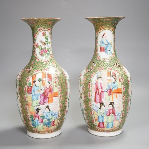 1343 - A pair of 19th century Chinese famille rose vases,24 cms high.