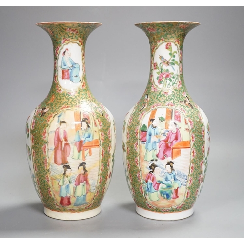 1343 - A pair of 19th century Chinese famille rose vases,24 cms high.