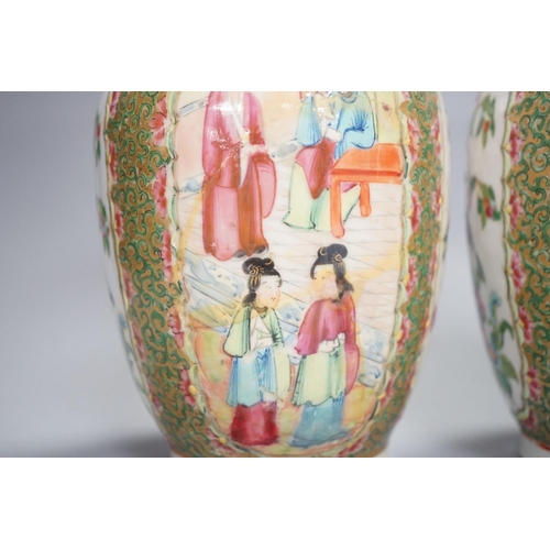 1343 - A pair of 19th century Chinese famille rose vases,24 cms high.