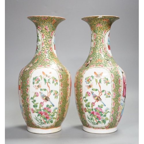 1343 - A pair of 19th century Chinese famille rose vases,24 cms high.