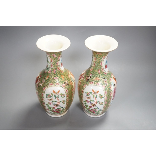 1343 - A pair of 19th century Chinese famille rose vases,24 cms high.