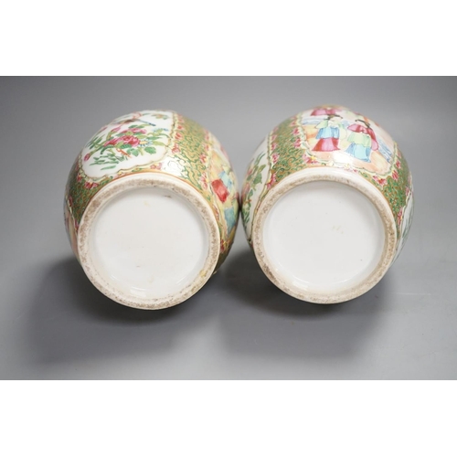 1343 - A pair of 19th century Chinese famille rose vases,24 cms high.