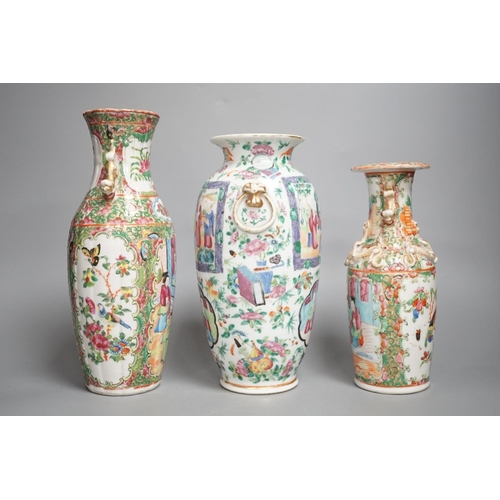 1354 - Three 19th century Chinese famille rose vases,Tallest 25 cms high.