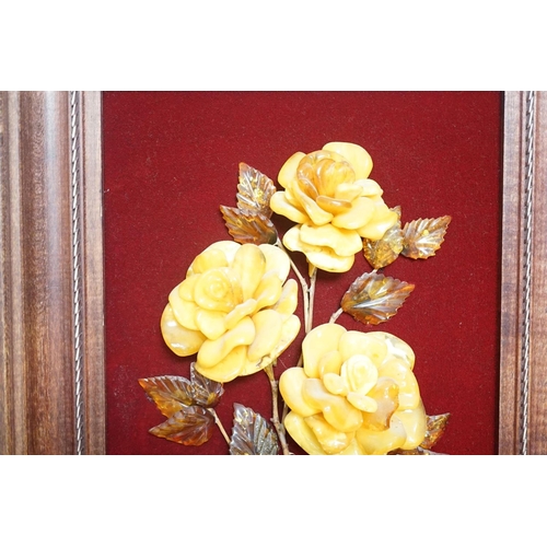 1363 - A carved amber panel from the Hermitage Museum shop, St Petersburg, roses in a vase. 49x39cm includi... 