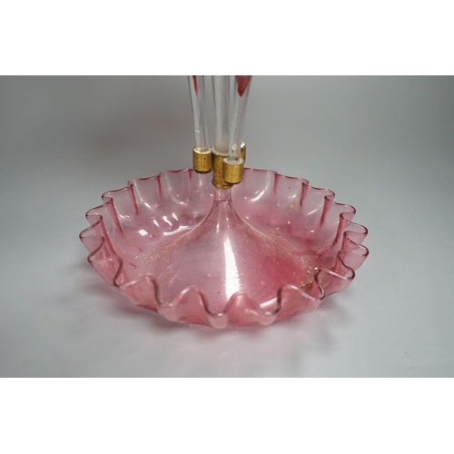 1365 - A Victorian cranberry glass four vase table centrepiece,52 cms high.