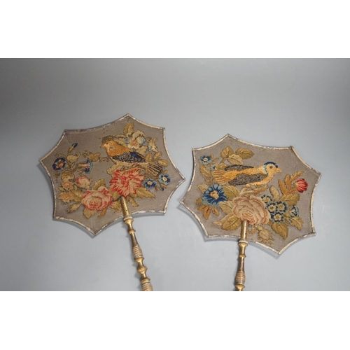 1366 - A pair of early Victorian petite point and cut steel hand screens,39 cms high.