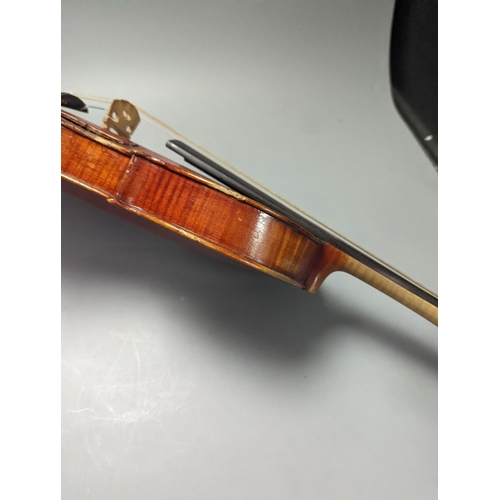 1370 - A violin in a mahogany case, case makers, Withers and sons,case 79 cms high.