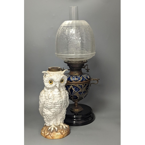 1373 - A Doulton Lambeth stoneware oil lamp and a German porcelain’owl’ lamp base,Oil lamp 54 cms high incl... 