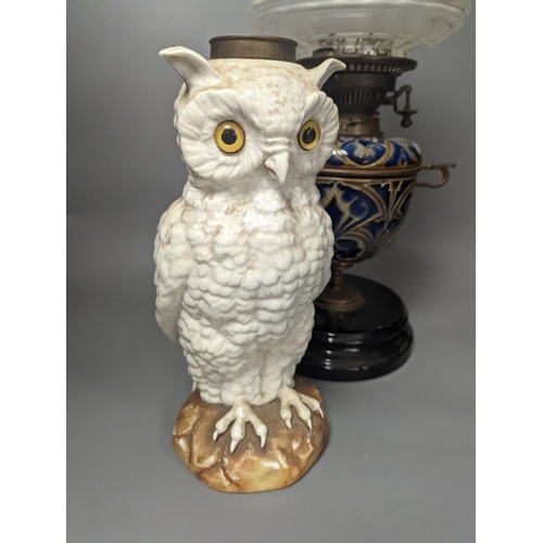 1373 - A Doulton Lambeth stoneware oil lamp and a German porcelain’owl’ lamp base,Oil lamp 54 cms high incl... 