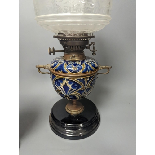 1373 - A Doulton Lambeth stoneware oil lamp and a German porcelain’owl’ lamp base,Oil lamp 54 cms high incl... 