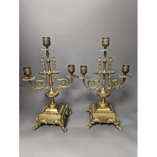 1374 - A 19th century French ornate brass clock garniture including a pair of 3 branch candelabraClock 42 c... 