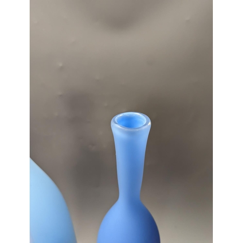 1379 - Three contemporary blue glass bottle vases,tallest 55cms high.