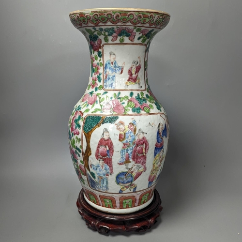 1381 - A 19th century Chinese famille rose vase on wooden stand,37 cms high including stand.... 