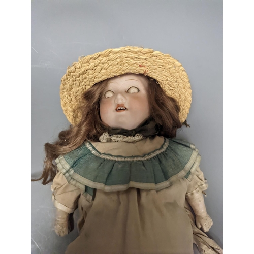 1382 - An Armand Marseille 370 bisque headed doll, wearing a basket weave boater and brown embroidered dres... 