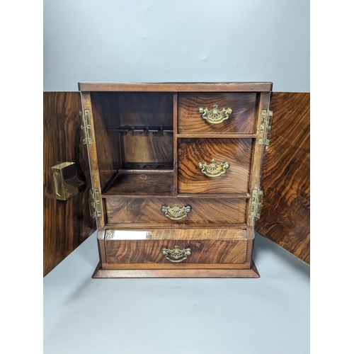 1383 - A 19th century mahogany tea caddy and a walnut  2 door smokers cabinet,Smokers cabinet 33 cms high.... 