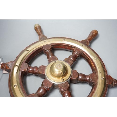 1385 - A hardwood and brass mounted Ship's wheel, signed Lawrence Simpson 50cm