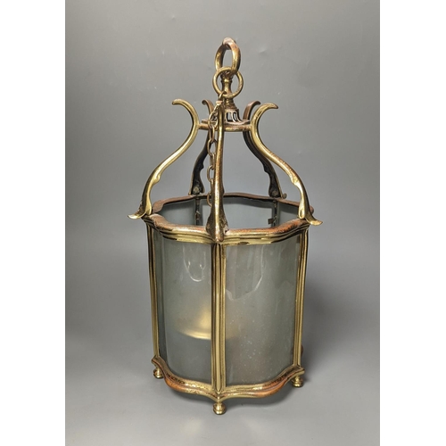 1396 - A brass hall lantern and a circular brass ceiling light fitting,hall lantern 40 cms high.... 