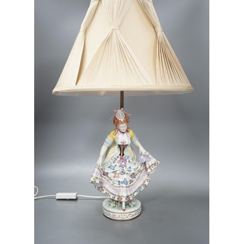 1405 - A German porcelain ‘dancing lady’ lamp,figure 29 cms high.