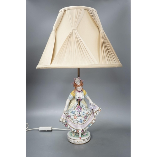 1405 - A German porcelain ‘dancing lady’ lamp,figure 29 cms high.