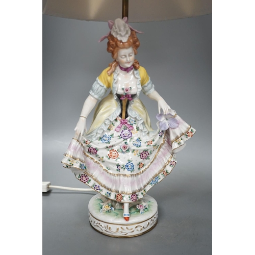 1405 - A German porcelain ‘dancing lady’ lamp,figure 29 cms high.