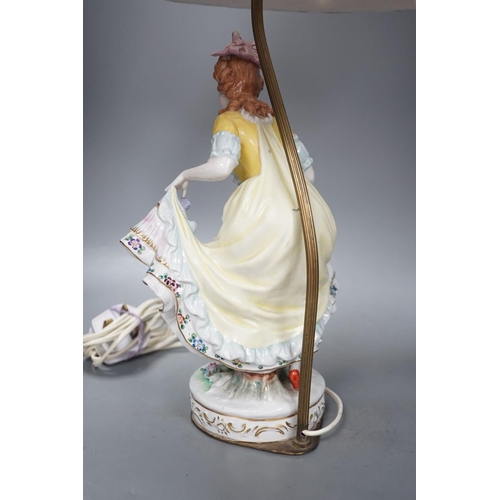 1405 - A German porcelain ‘dancing lady’ lamp,figure 29 cms high.