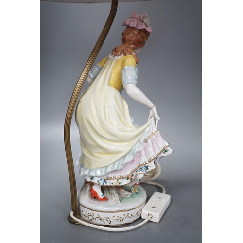 1405 - A German porcelain ‘dancing lady’ lamp,figure 29 cms high.