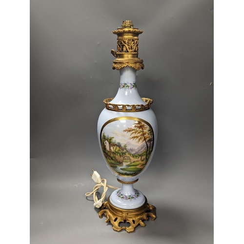 1407 - A French 19th century porcelain and ormolu oil lamp (later converted to an eclectic lamp),54 cms hig... 