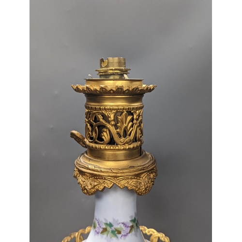 1407 - A French 19th century porcelain and ormolu oil lamp (later converted to an eclectic lamp),54 cms hig... 