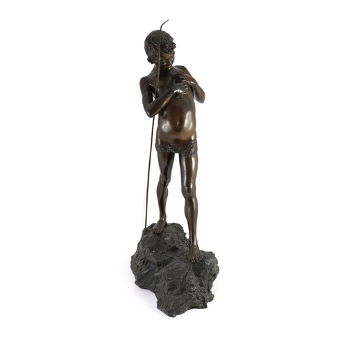 1408 - Giovanni Varlese (Italian, 1888-1922). A bronze figure of a fisherboy standing holding a fish to his... 