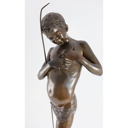 1408 - Giovanni Varlese (Italian, 1888-1922). A bronze figure of a fisherboy standing holding a fish to his... 