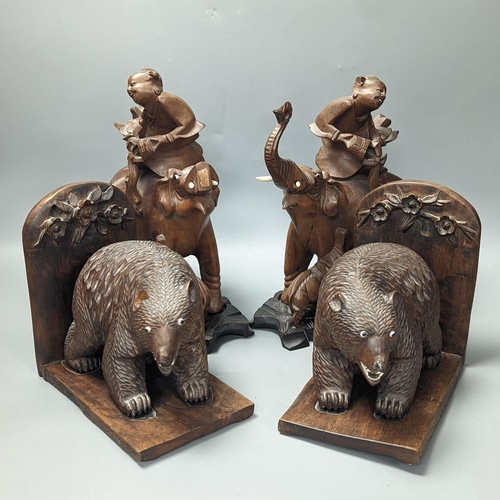 1410 - A pair of Chinese wood carvings figures on elephants, a pair of Chinese bear bookends,Chines figures... 