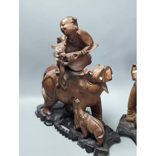 1410 - A pair of Chinese wood carvings figures on elephants, a pair of Chinese bear bookends,Chines figures... 