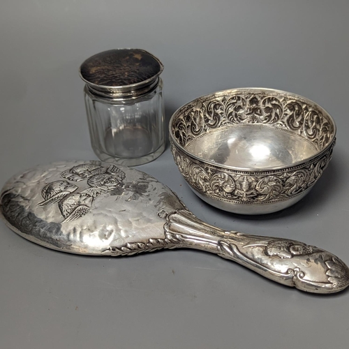 1805 - An Edwardian silver mounted 'Reynold's Angels' hand mirror, a silver and tortoiseshell lidded glass ... 