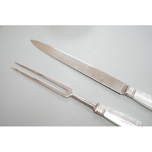 1806 - A pair of Georg Jensen sterling handled carving knife and fork, knife 34.4cm.