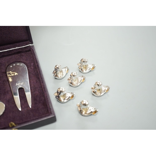 1807 - A modern Asprey cased silver golfer's companion set, comprising a tee, marker and pitch mark repaire... 