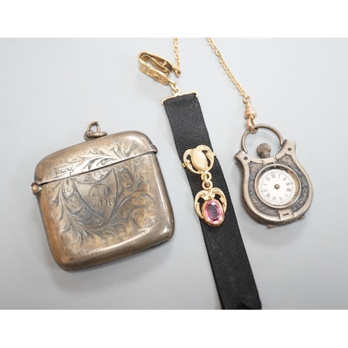 1808 - A silver vesta case, 48mm and a white metal cased fob watch,  on a black sash suspension.... 