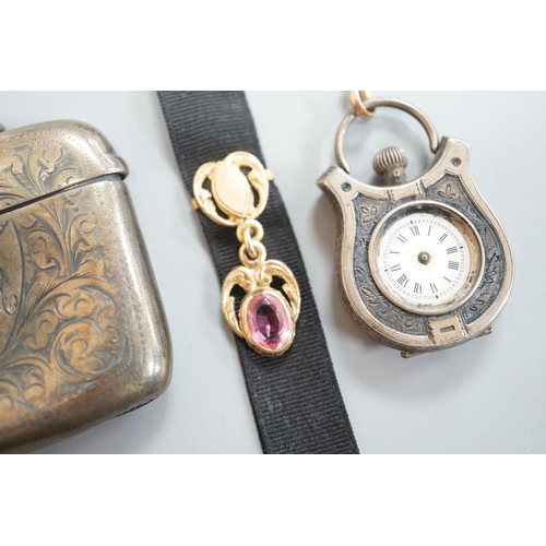 1808 - A silver vesta case, 48mm and a white metal cased fob watch,  on a black sash suspension.... 