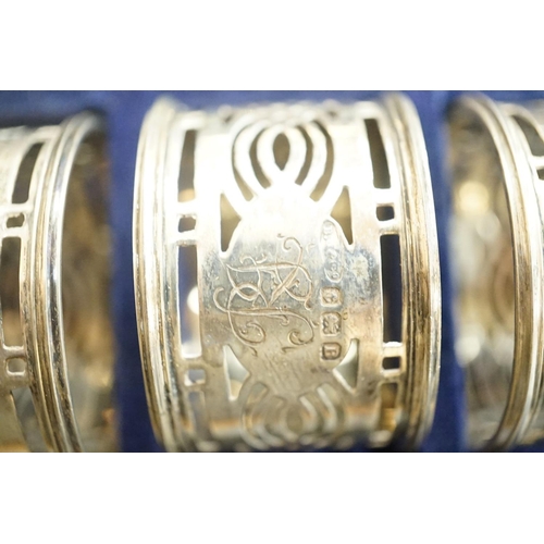 1809 - A cased set of six George V pierced silver napkin rings, Birmingham, 1926.