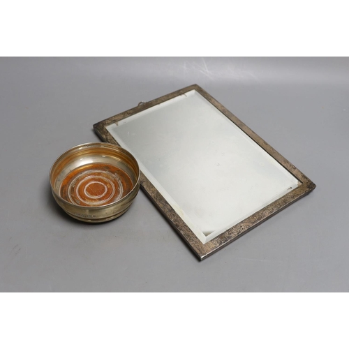 1817 - A George V silver mounted photograph frame, 25.5cm and a modern silver wine coaster, 10.3cm.... 